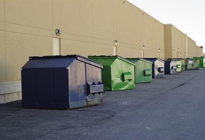 a yellow construction dumpster on a work site in Christmas, FL